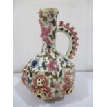 A Zsolnay ewer with pierced decoration against a hand painted design- slight chip and small loss
