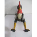 A wooden cockerel figure with articulated limbs - both feet A/F