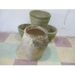 A set of three garden pots along with one other