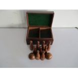 Wooden set of skittles and two balls in mahogany case