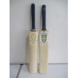 Two signed cricket bats, one signed by Hampshire 2004 team including Shane Warne, Michael Clarke,