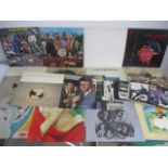 A collection of LPs and 7" singles including The Beatles White Album, Cat Stevens, Black Sabbath,