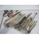 A collection of various telescopic toasting forks etc