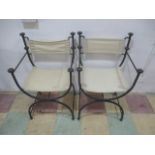 A pair of metal framed garden chairs