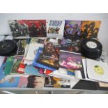 A collection of 7" vinyl singles including Queen, Madonna, Genesis, Jefferson Starship, Rainbow,