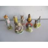 A collection of five Beswick and two Royal Albert Beatrix Potter's figurines including Foxy