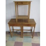 A pair of light oak bedside tables along with a pine bedside table