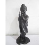 A late 19th century Japanese bronze of a lady holding a lotus blossom and a pair of scissors, 30cm