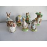 A collection of seven Beswick Beatrix Potter figurines including Peter Rabbit, Benjamin Rabbit,