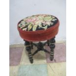 A Victorian ebonised piano stool