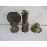 A vintage miners lamp, along with two others