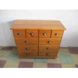 A pine chest of ten drawers