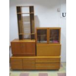 Three Tapley mid century teak wall units along with a CD rack and a G-Plan cupboard