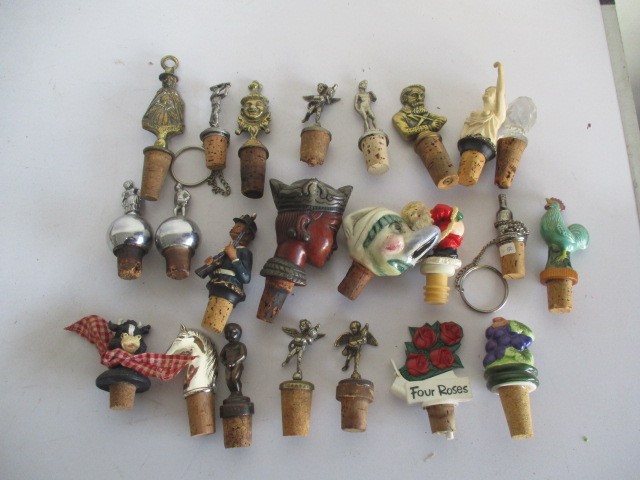 A collection of various novelty bottle stoppers