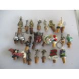 A collection of various novelty bottle stoppers