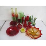 A collection of various coloured glassware