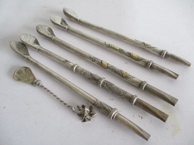 Five continental 800 silver 'opium spoons'/mate spoons some with overlaid gold decoration and one