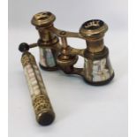 A pair of mother of pearl opera glasses on telescopic handle