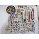 A collection of costume and some silver jewellery, buttons etc