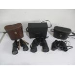 A collection of three pairs of binoculars including Lieberman and Gortz, Super Zenith and Jaguar