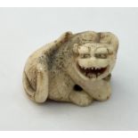 A 19th century stag horn netsuke of a dragon.