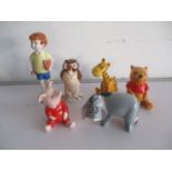 A collection of six Beswick Walt Disney figurines including Winnie The Pooh, Christopher Robin,