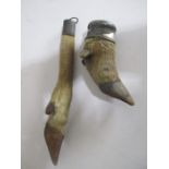 A hallmarked silver mounted deer's foot dated 1912 along with one other silver plated trophy named
