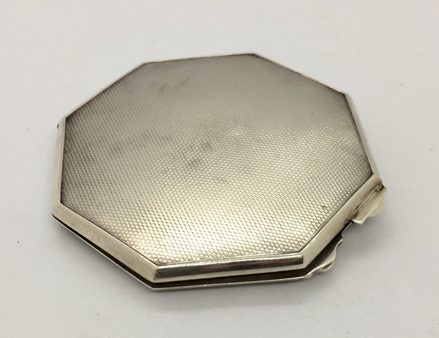 A hallmarked silver ladies compact.