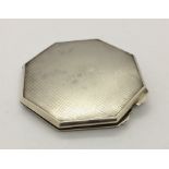 A hallmarked silver ladies compact.