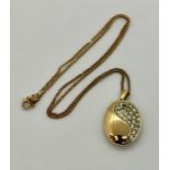 A 9 ct gold chain with gold coloured pendant ( chain 2.3g)
