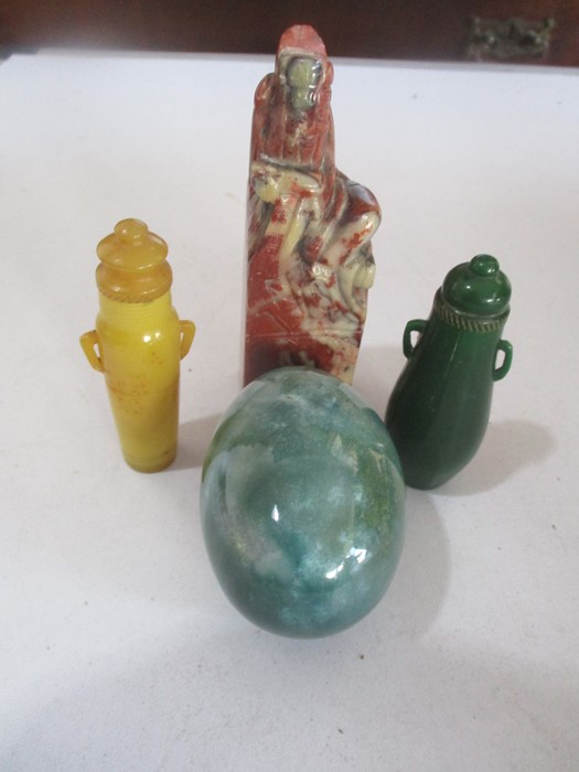 A soapstone carving of a Deity, hardstone egg and two scent bottles