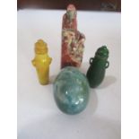 A soapstone carving of a Deity, hardstone egg and two scent bottles