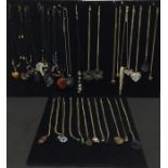 A collection of assorted necklaces including glass pendants