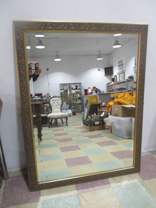 A large gilt mirror, 134cm x 104cm