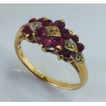 A 9 ct gold dress ring set with diamonds and rubies, size P 1/2