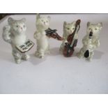 A Beswick four piece cat orchestra, tiny chip to underside of score and tip of violin bow