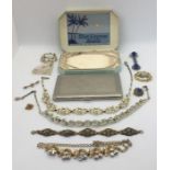A small collection of costume jewellery, cigarette case etc.