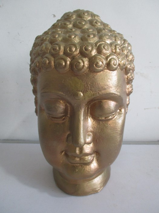 A gilt Buddha head, 27.5cm height