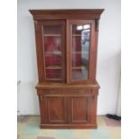 A Victorian mahogany display cabinet on cupboard