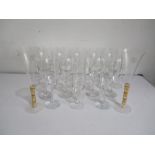 A collection of 24 various champagne flutes