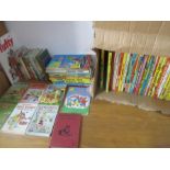 A collection of vintage children's books including Enid Blyton along with various annuals etc.