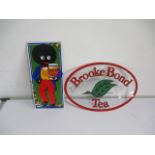 A reproduction enamelled Golden Shred sign along with a glass Brooke Bond tea sign