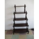 A Victorian Rosewood Whatnot with barley twist supports