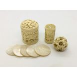 A Cantonese carved ivory pot containing mother of pearl gaming counters, each carved with a