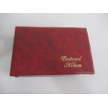 A military postcard album including silk cards etc