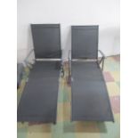 Two reclining Florabest outdoor sun loungers.