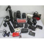 A collection of various camera's, lenses and binoculars, including Canon, Olympus, Pentax etc