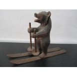 A Black Forest bear on skis- 1 arm repaired