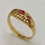 An 18ct gold diamond and ruby five stone ring