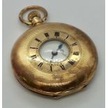 A 15ct rose gold half hunter pocket watch with subsidiary second hand dial
